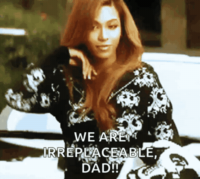 Woman In Pink Jacket Sitting On Couch With Text Are You Smarter Than Celebrity GIF