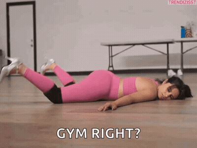 Woman In Pink Leggings Laying Next To Gym Right GIF