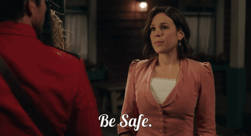 Woman In Pink, Man In Red, Be Safe GIF