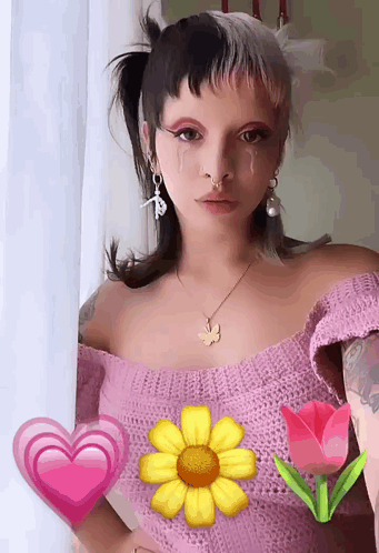 Woman In Pink Off-Shoulder Top With Butterfly Necklace GIF