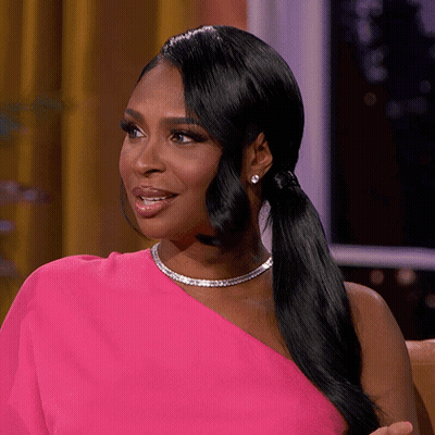 Woman In Pink One Shoulder Dress And Necklace GIF