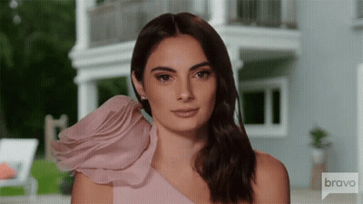 Woman In Pink One Shoulder Dress Looking At Camera GIF