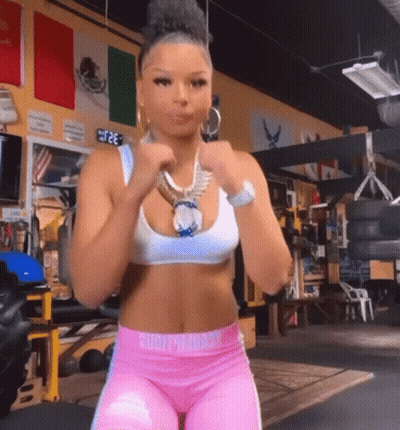 Woman In Pink Pants And White Tank Top GIF