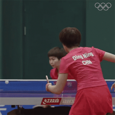 Woman In Pink Ping Pong Shirt Playing Ping Pong GIF