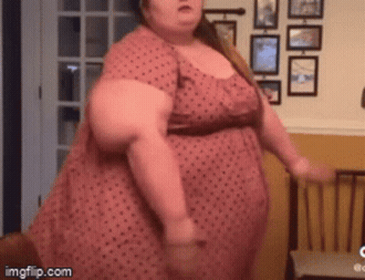 Woman In Pink Polka Dot Dress Dancing GIF