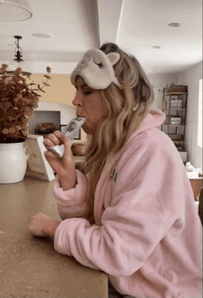 Woman In Pink Robe With Sleep Mask GIF