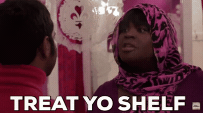 Woman In Pink Scarf Talking To Man In Red Jacket GIF