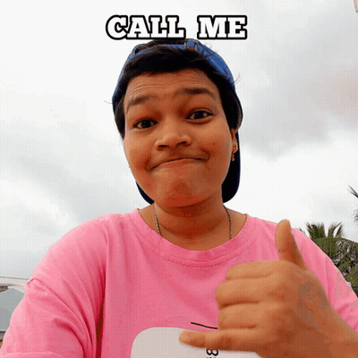 Woman In Pink Shirt And Blue Hat Thumbs Up Saying Call Me GIF