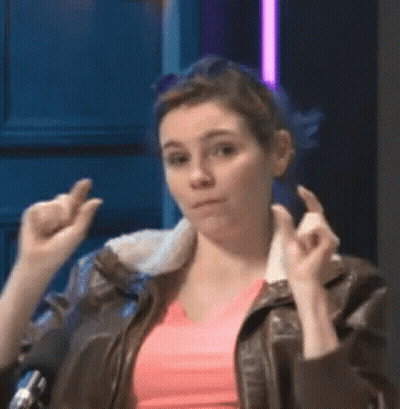 Woman In Pink Shirt And Brown Leather Jacket Making Funny Face GIF