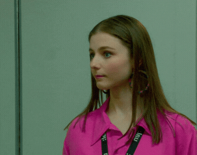Woman In Pink Shirt And Earrings GIF