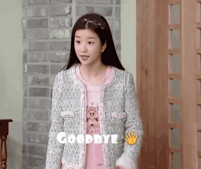 Woman In Pink Shirt And Grey Jacket Saying Goodbye GIF