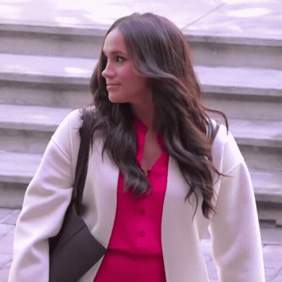 Woman In Pink Shirt And White Coat GIF