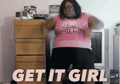 Woman In Pink Shirt Dancing In Front Of Get It Girl Sign GIF