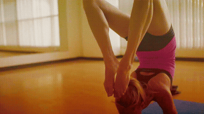 Woman In Pink Shirt Doing Handstand GIF