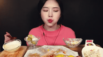 Woman In Pink Shirt Eating Food With Spoon GIF