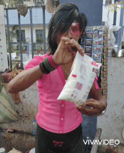 Woman In Pink Shirt Holding Vivavideo Bag GIF