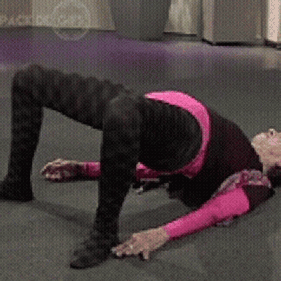 Woman In Pink Shirt Kneeling GIF