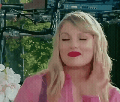 Woman In Pink Shirt Making Face GIF