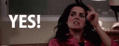 Woman In Pink Shirt Making Funny Face Saying Yes GIF