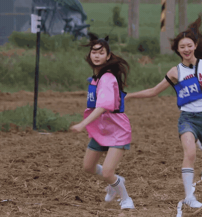Woman In Pink Shirt Running On Dirt Field GIF
