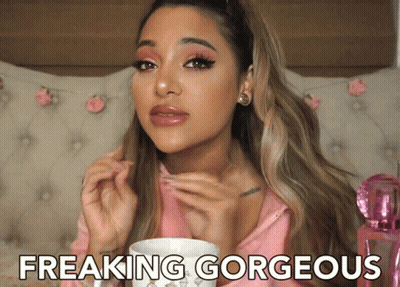 Woman In Pink Shirt Saying Freaking Gorgeous Holding Cup GIF