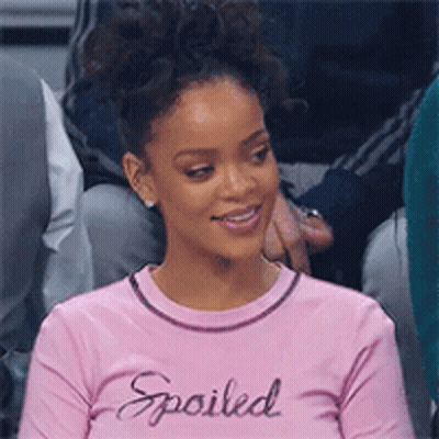 Woman In Pink Shirt Saying Spoiled Sitting In Crowd GIF