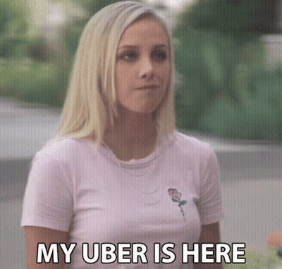 Woman In Pink Shirt Saying Uber Is Here GIF