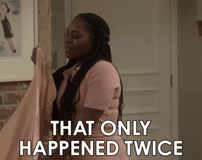 Woman In Pink Shirt Says That Only Happened Twice Holding Cloth GIF