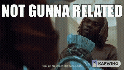 Woman In Pink Shirt Sitting With Hands On Stomach GIF