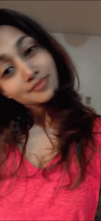Woman In Pink Shirt Taking Selfie GIF