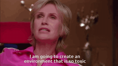 Woman In Pink Shirt Talking About Toxic Environment GIF