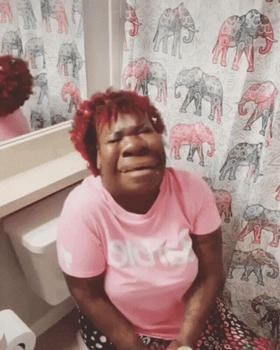 Woman In Pink Shirt With Bitch On Toilet GIF