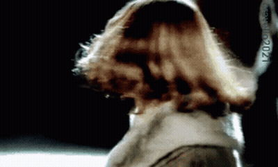 Woman In Pink Shirt With Earrings GIF
