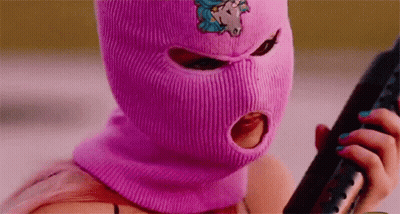 Woman In Pink Ski Mask Holding Gun GIF