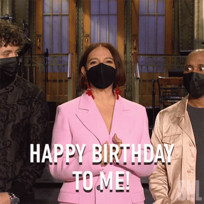 Woman In Pink Suit And Black Mask Saying Happy Birthday To Me GIF