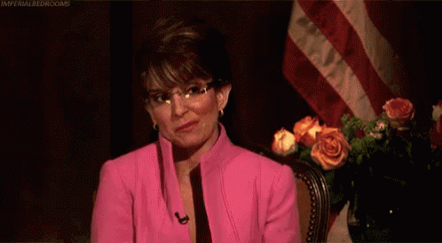 Woman In Pink Suit Saying You're Welcome GIF