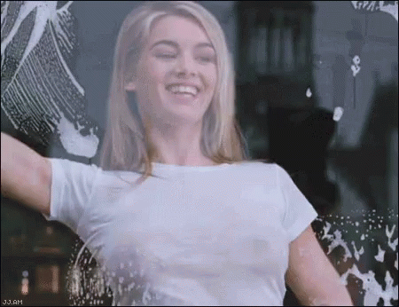 Woman In Pink Suit Smiling GIF