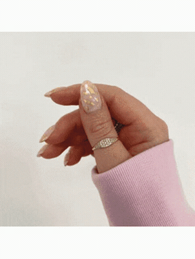 Woman In Pink Sweater And Gold Ring GIF