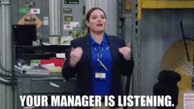 Woman In Pink Sweater Next To Man In Wheelchair At Desk GIF