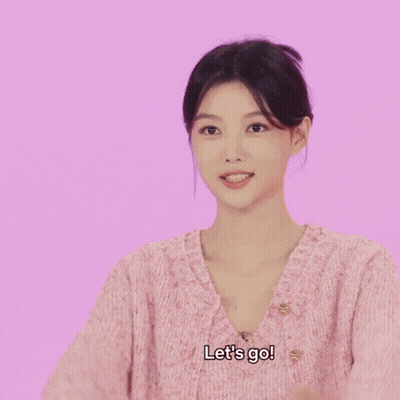 Woman In Pink Sweater Saying Let's Go GIF