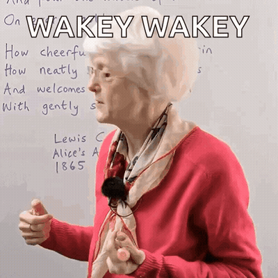 Woman In Pink Sweater Saying Wakey Wakey GIF