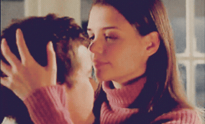 Woman In Pink Sweater Touching Man's Face GIF