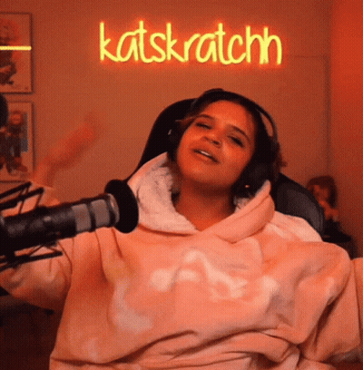 Woman In Pink Sweatshirt And Headphones At Katskratchn GIF