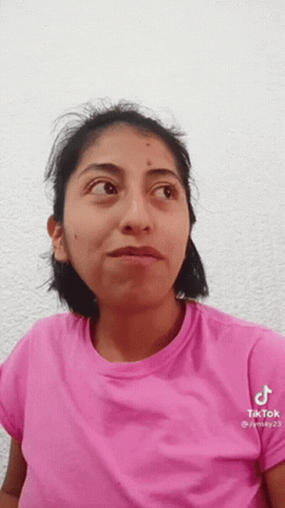 Woman In Pink T-Shirt Making Funny Face GIF