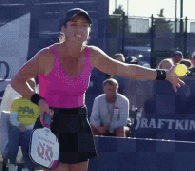 Woman In Pink Tank Top Holding Tennis Ball And Paddle With 60 GIF