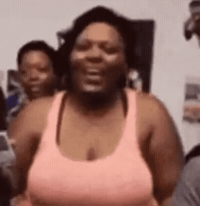 Woman In Pink Tank Top Laughing GIF