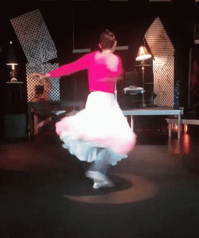 Woman In Pink Top And White Skirt Dancing GIF