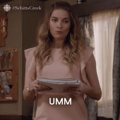 Woman In Pink Top Holding Papers Umm GIF