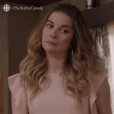 Woman In Pink Top Making Face GIF