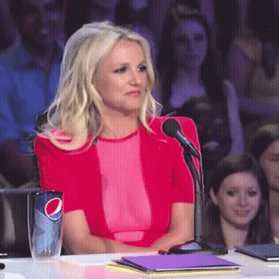 Woman In Pink Top Sitting At Table With Pepsi Cup GIF